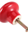 Killer Red Ceramic Cabinet Knobs 35 Pack Mushroom Button Single Hole Door Pulls With Screws For Kitchen Cupboard Dresser Wardrobe Fresh Smooth Glossy Finish, detailed view of glossy red knob with screw.