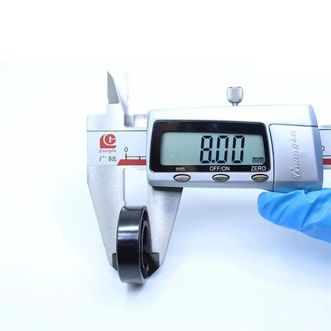 Kickass Heat Resistant Bearings 12X28X8Mm 500C Double Sealed Steel Balls being measured at 8.00mm with caliper tool.