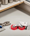 Built Tough Double Wheel Sliding Glass Door Rollers Designed For Slick Operation And Zero Friction Glide Crafted From Heavy Gauge Stainless Steel For Rock Solid Track Hardware Kits Of Two on workbench with pliers.