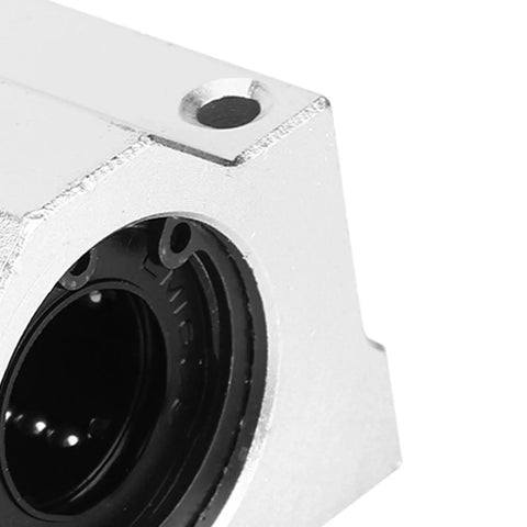 Close-up of Rock Solid Aluminum Alloy Linear Motion Ball Bearing Slide Block showing aluminum body and black interior housing.