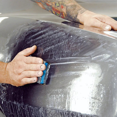 Heavy Duty Sandpaper Kit 20 Sheets For Wet And Dry Use in action on an auto body panel, showcasing dust-free and anti-blocking features.