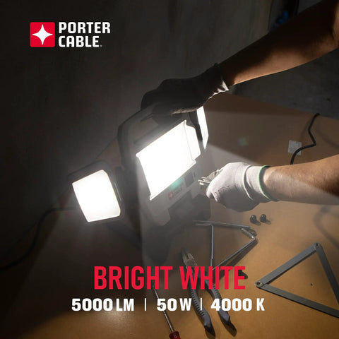 Person assembling Heavy Duty 50W LED Work Light With Three Head Stand Portable Corded for construction and garage use, 5000 lm.