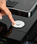 Close-up of a hand pressing the button on the Top Notch Automatic Espresso And Coffee Machine With Built In Grinder And Smart Touchscreen.