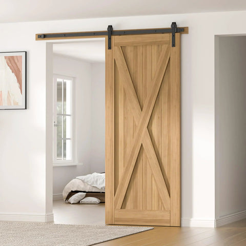 Installed view of Six Point Six Feet Long Sliding Barn Door Hardware Kit For Single Door Sturdy Durable Carbon Steel With Black Coating To Prevent Rust Heavy Duty Easy To Install Fits Thirty Six To Forty Inch Wide Doors J Shape Hanger Included with wooden door in a bright room.