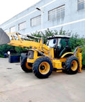 4WD Backhoe Loader With 2.4m Digging Depth, Tractor Loader Digger parked at industrial site with digging arm extended