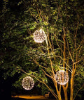 Trees adorned with 16 Inch LED Light Ball For Indoor And Outdoor Use With Warm White Lights Waterproof And Durable Lightweight Holiday Decor