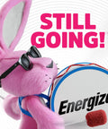 Energizer pink bunny character with sunglasses drumming, showcasing endurance with slogan 'STILL GOING!'. Animated fun for kids.