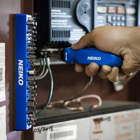 Person using 37 Hole 1 Quarter Inch Hex Bit Organizer And Drill Bit Holder With Magnetic Base For Screwdriver Bits Keeps Your Bits Conveniently All In One Case For Quick Access On The Job And In Your Toolbox attached to electrical box.