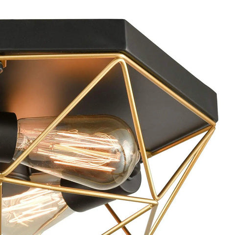 Close-up of Brass Industrial Flush Mount Ceiling Light 3 Light Square Cage Fixture in Black and Gold with glowing bulbs