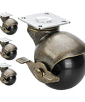 Four Pack Top Shelf Brass Ball Casters For Furniture Antique Finish Swivel Wheels With Secure Top Plate 1.5 Inch Heavy Duty Roller Units That Are Hella Smooth For Living Room Setups, close-up of caster with locking brake.