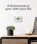 5 2 Day Programmable Thermostat With Easy Weekday Weekend Scheduling Precise Temperature Control To Within 1 Degree on a white wall