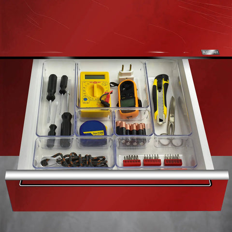 7 Piece Drawer Organizer Set With 4 Different Sizes Clear Crystal Plastic Trays For Office Home Makeup Kitchen And Junk Drawer Modular Build For Customizable Storage And Easy Grab And Go Organization installed in a red drawer holding tools and accessories.