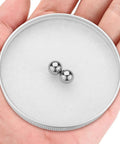 Heavy Duty 2Pc Tungsten Carbide Bearing Balls 10MM Diameter G5 Precision Grade displayed in hand on white background.