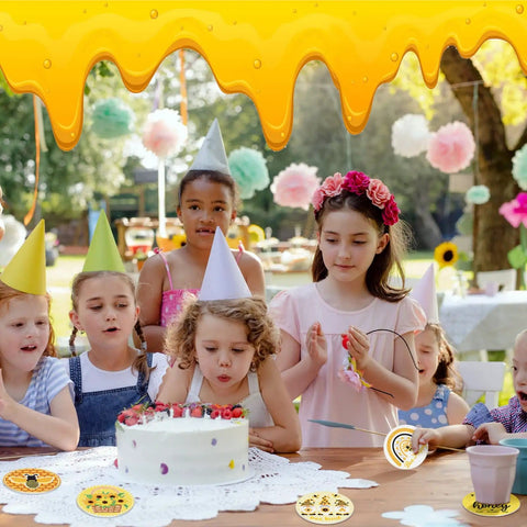Children at a birthday party with a cake and Bee Themed Diamond Painting Coasters Kit With Holder Eight Pattern Coasters.