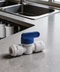 5 Pack 3 8 Inch Push In Ball Valve Quick Connect Plumbing Fitting Leak Proof Polypropylene on kitchen countertop for easy fluid control.