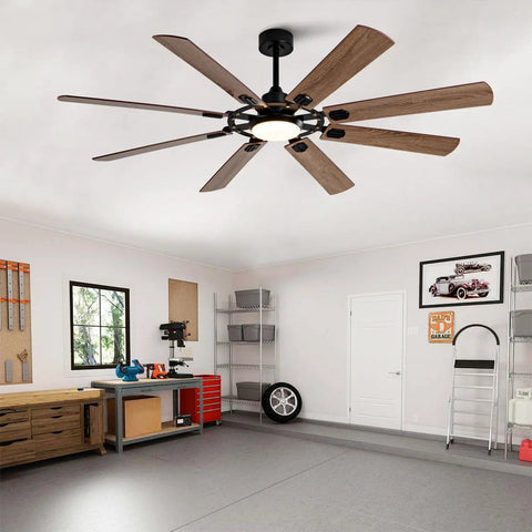 Large Ceiling Fan with Light in a workshop, featuring wood blades and a black base, providing efficient airflow and illumination.