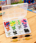 Complete Fingerboard Repair Kit With Slick Trucks Badass Hardware Smooth Wheels Tough Hex Nuts Extra Screws Precision Driver And Solid Brackets For Mini Skate Mods And Fresh Custom Builds in a clear storage case.