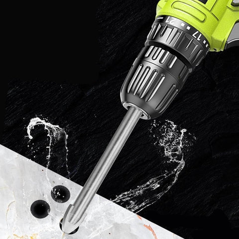 Front view of a green cordless drill with a 6mm carbide tile drill bit drilling into ceramic tile.
