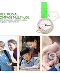 Directional compass with a green strap for educational and outdoor use; part of Thumb Orienteering Compass Handheld Directional Compass for Hiking and Camping Portable Outdoor Navigation Tool with Fast Needle Positioning Survival Gear for Back To Start Orientation and Easy Trail Finding.