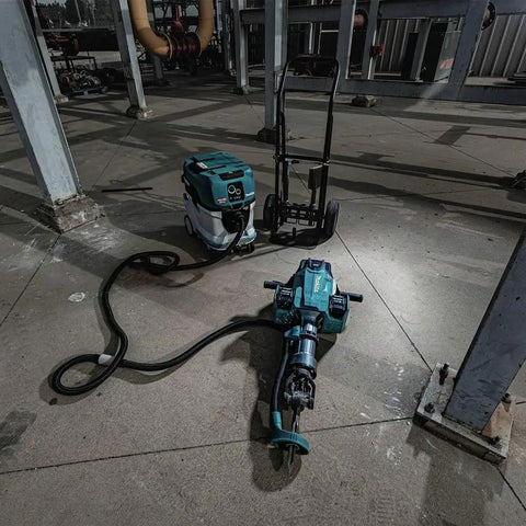 Badass Heavy Duty Eighty Volt Brushless Cordless Breaker Hammer With Seventy Foot Pounds Of Knockout Chisel Power And One One Eighth Inch Hex Shank Avt Anti Vibration Aws Compatible Demolition Kit Featuring Four Massive Eight Amp Hour Packs For Concrete on a worksite.
