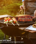 Nonstick Rib Rack For Grilling And Smokin Holds Four Rib Racks Porcelain Coated Steel Stand on a grill with skewers