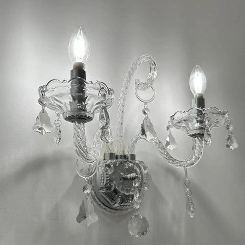 Elegant Crystal Wall Sconce Candles Set Of 2 For Living Room Bath Entryway Hallway Hardwired Classic Wall Lights With Glam Crystal Accents And A Lit Glow For Hotels Galleries Exhibition Rooms. Two illuminated crystal wall sconces with detailed accents.