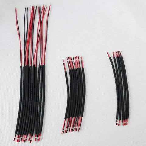 Workhorse Automatic Wire Cutting And Stripping System Handles Two To Four Conductor Cable showing organized wire strands in various lengths.