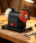 Heavy Duty Mini Bench Grinder Packed With Dual Grinding Wheels For Sharpening And Deburring Compact tabletop sander on workbench.