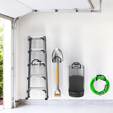 Badass Heavy Duty Garage Storage Hooks hold ladder, shovel, cart, and hose on wall for organized tool storage.