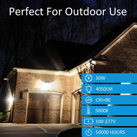 Night view of brick house with Wall Pack Light High Efficiency No Fuss 30W 4050lm 5000K Dusk To Dawn Photocell Outdoor Security Flood Light illuminating the entrance.