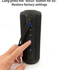 Hand pressing button on Outdoor Waterproof Bluetooth Speaker With Bass Boost And 35W Power For Loud Stereo Sound IPX7 Portable Party Speaker