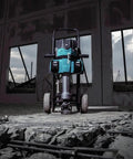 Badass Heavy Duty Eighty Volt Brushless Cordless Breaker Hammer With Seventy Foot Pounds Of Knockout Chisel Power positioned on rubble.