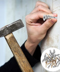 Person inserting a Heavy Duty Drywall Anchor Kit With Screws, 20 Sets, Self Drilling Zinc Alloy And Iron, Easy Insertion in wall.
