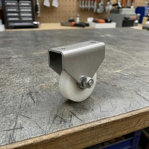 Heavy Duty Double Hole Bracket Pulley With Nylon Wheel Track Roller And Sealed Bearing Axle on wooden surface, showcasing sturdy design.