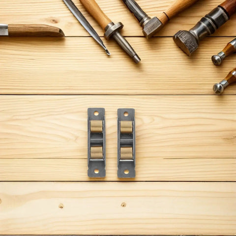 Heavy Duty Stainless Steel Sliding Door Wheels Featuring Double Bearing Pulleys on wood surface with tools.