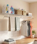 Kick Floor Clutter To The Curb With These Heavy Duty Wall Mounted Closet Shelves Featuring A Ventilated Metal Wire Rack And Sturdy Hanging Rod For Seamless Vertical Organization Setup. White wall-mounted shelf with hanging rod, storage bins, and folded towels.