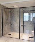 Heavy Duty Glass Shower Hinge 2 Pack Featuring 180 Degree Rotation And Solid Clamp For Serious Bathroom Upgrades That Are Rustproof Built Different And Dead Simple To Install Without Breaking A Sweat, enhancing a modern shower with sleek glass and brushed metal.