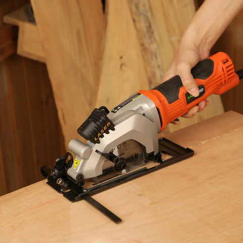 Heavy Duty Mini Circular Saw With Beefy 4 Amp Motor And Crisp Laser Sight For Dang Clean Cuts On PVC Laminate Drywall And 2x4s Featuring Slick Dust Collection Port in use on wood.
