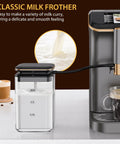 Classic milk frother with clear container, used for creating smooth milk for cappuccinos and lattes, next to espresso maker.