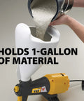 Pro Grade Electric Texture Sprayer Featuring Three Ready To Roll Swappable Nozzles For Acoustical Popcorn Knockdown Orange Peel Coatings On Ceilings Walls Fast Lock N Go Setup Makes Weekend Renovations A Breeze showing 1-gallon adjustable cup being filled.