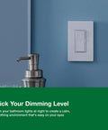 Super Sleek LED Dimmer Switch Compatible With Single Pole Or Three Way Wiring on blue wall with silver soap dispenser.