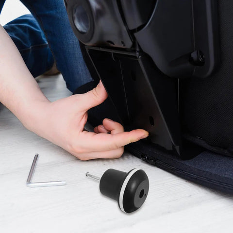 Person installing Five Pack Office Chair Bell Glide Replacement Casters on a chair with tools on a wooden floor.
