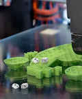 Solid Hammer Head M3 And M5 T Slot Nuts Made From Tough Carbon Steel among green 3D printed parts on build plate.