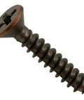 Close-up of a Bronze Phillips Flat Decorative Screw Size Six By Three Quarters Inch Sheet Metal Screw with flat head and bronze finish.
