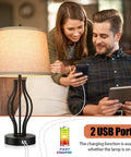 Couple using phones beside Two Pack Touch Control 3-Way Dimmable Table Lamps With USB Ports, 22 Inch Modern Bedside Lamps, Beige Fabric Shade