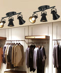 Three Light Black Track Lighting Kit With Rotatable Heads in a closet setting for industrial ceiling light application