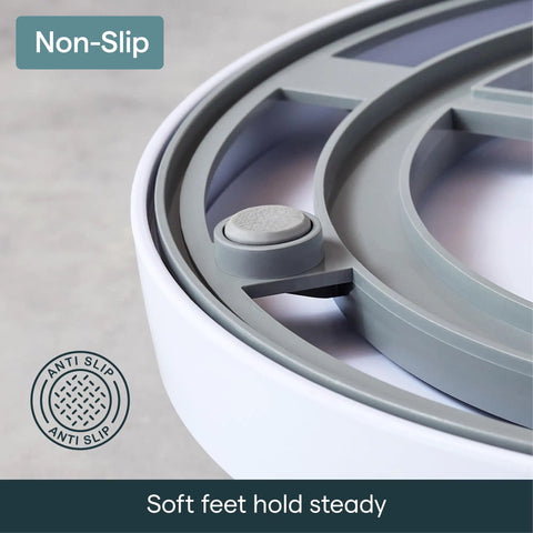 Smooth As Butter Three Bin Rotating Lazy Susan Turntable's non-slip feet ensuring stable use in cabinet organization.