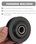 Heavy Duty Nylon Sliding Door Pulley Wheel Roller Featuring Zero Sweat Setup And Smooth Silent Glide For Big Time Home Upgrades And Reliable Heavy Load Support in hand, showcasing black nylon material and bearing.