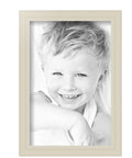 Fresh White Wooden Photo Frame 8X12 Inch Ready To Hang Clean Wall Decor With Crystal Clear Glass displaying smiling child portrait.