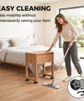 Self Adhesive Swivel Caster Wheels For Ultra Heavy Furniture Rolling With 360 Degree Spin and Easy Peel Sticky Back Pads visible under a wooden table.